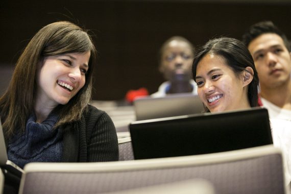 An-Hoa Giang, M17, right, shares a moment with a classmate during an anatomy lecture at the Tufts University School of Medicine on January 24, 2014. (Alonso Nichols/Tufts University)