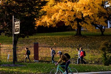 tufts landscape fall students walking across lawn