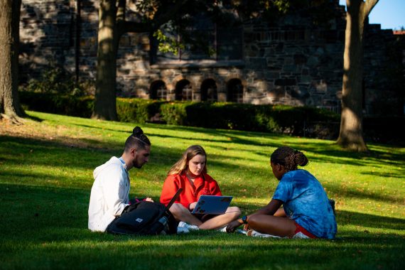 Students study on the lawn below Goddard Chapel on October 13, 2021. (Alonso Nichols/Tufts University)