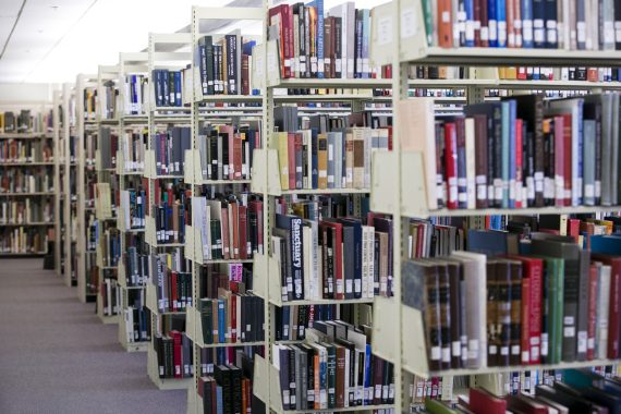 Rows of bookshelves in Tuft's library.