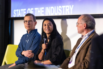 Bruce Freidrich of the Good Food Institute, Isha Datar of New Harvest, and Mark Post of Mosa Meat speak at a conference panel.