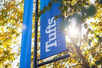A stock photo of signage identifying Tufts University
