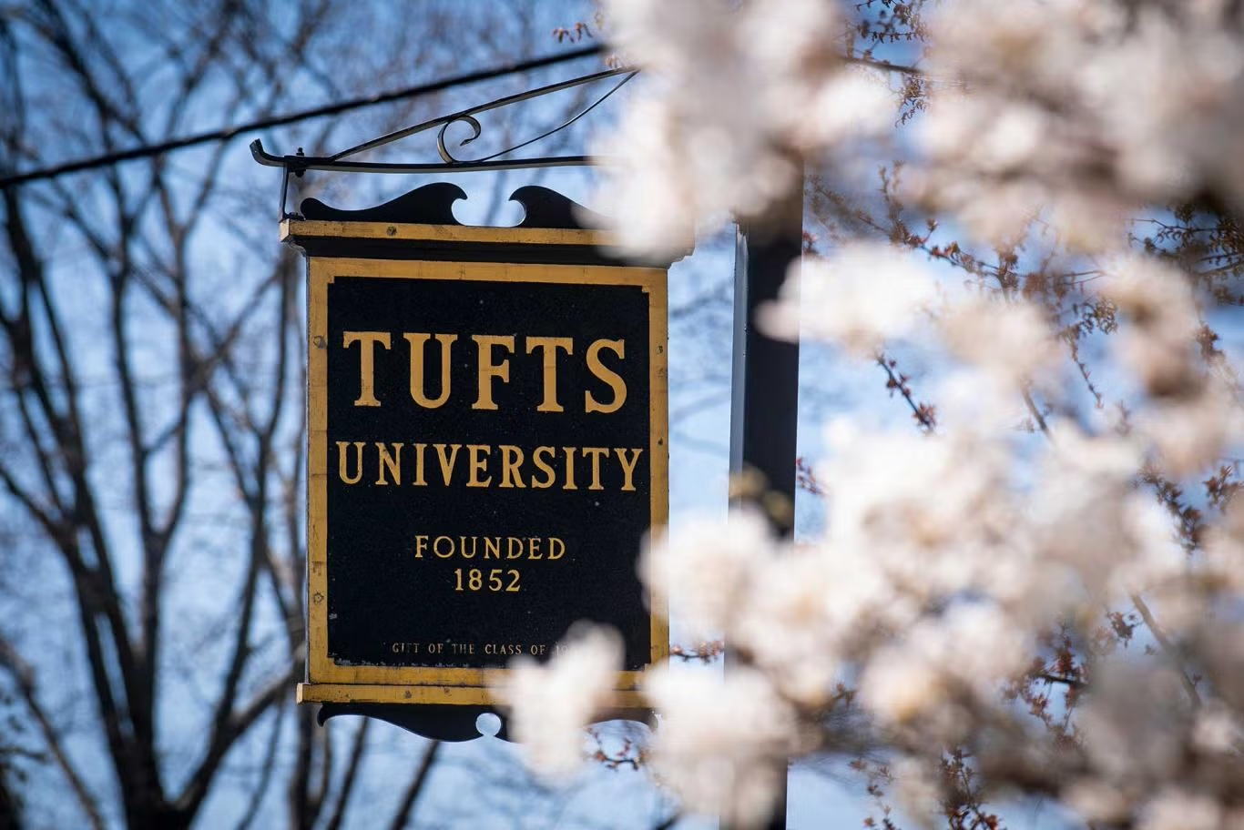 A sign reading Tufts University, founded 1852.